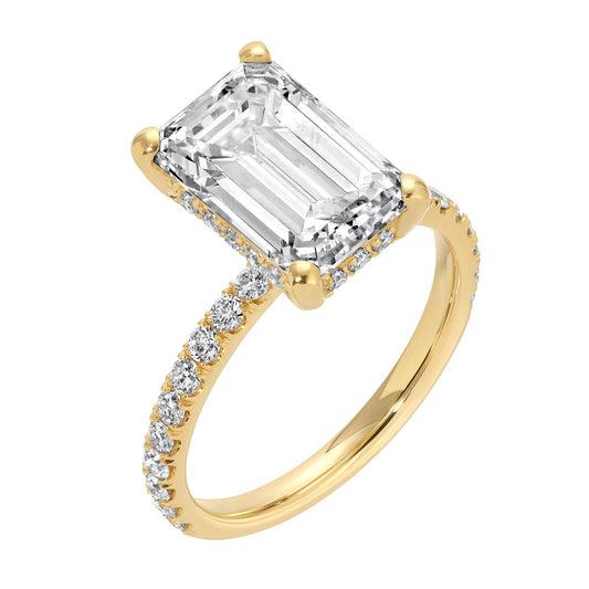 14K yellow gold emerald cut diamond ring with side stones and 4.59 carat total weight